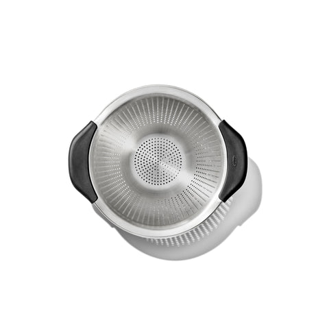 OXO Good Grips perforation pattern close-up showing fast drainage and even straining benefit