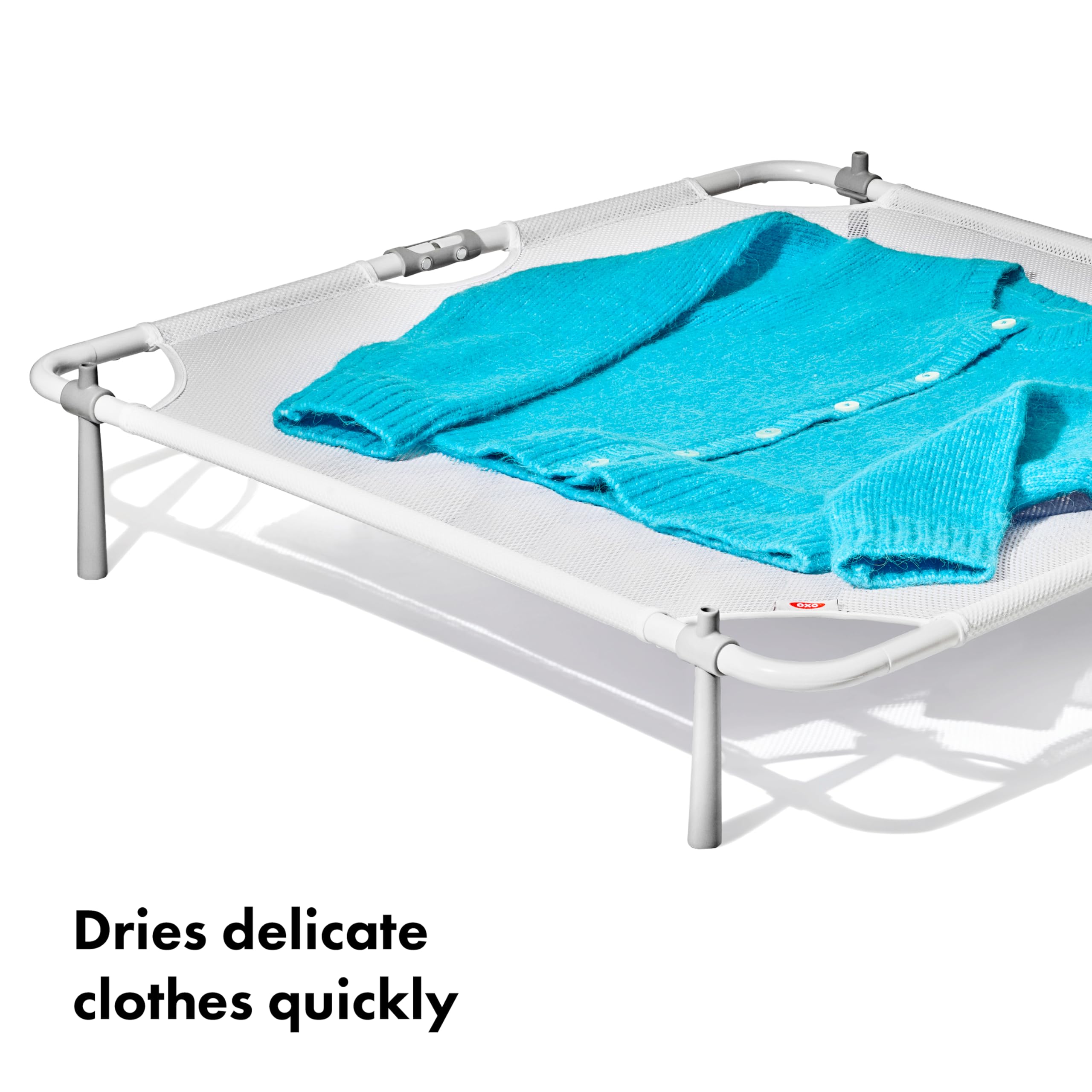 OXO rack placed on washing machine demonstrating space-saving benefit