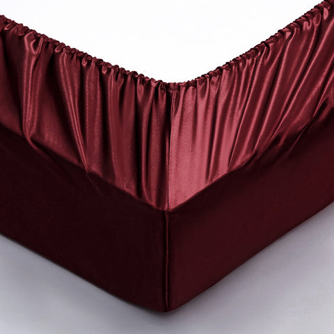 P Pothuiny styled bedroom with burgundy sheets illustrating luxury look and easy decorating