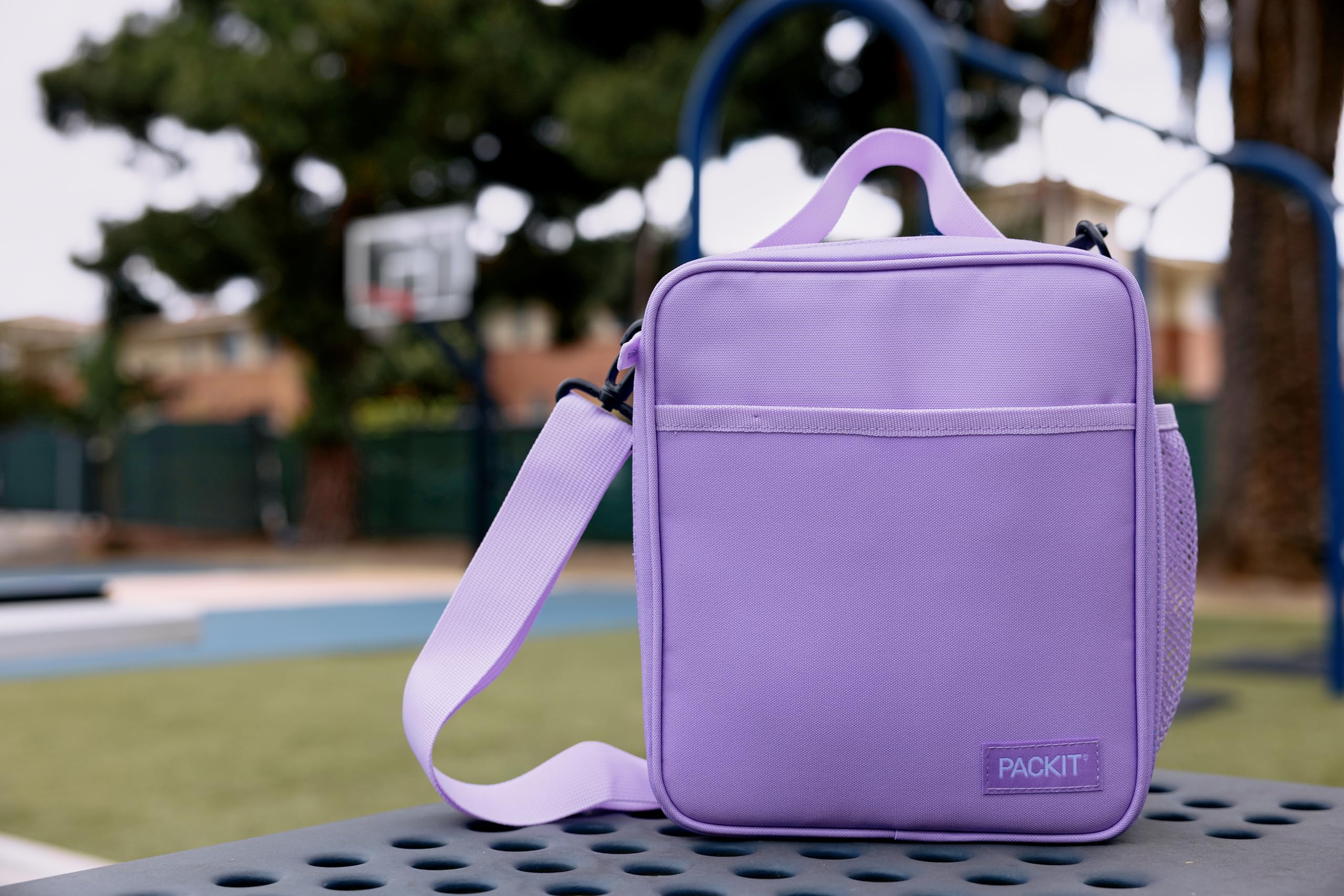 PackIt lavender lunch box in commuter setting demonstrating everyday convenience benefit