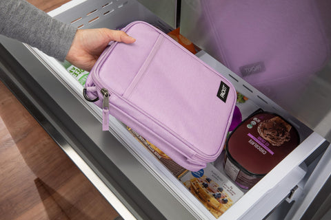 PackIt side mesh pocket with bottle showing extra storage and quick reach benefit