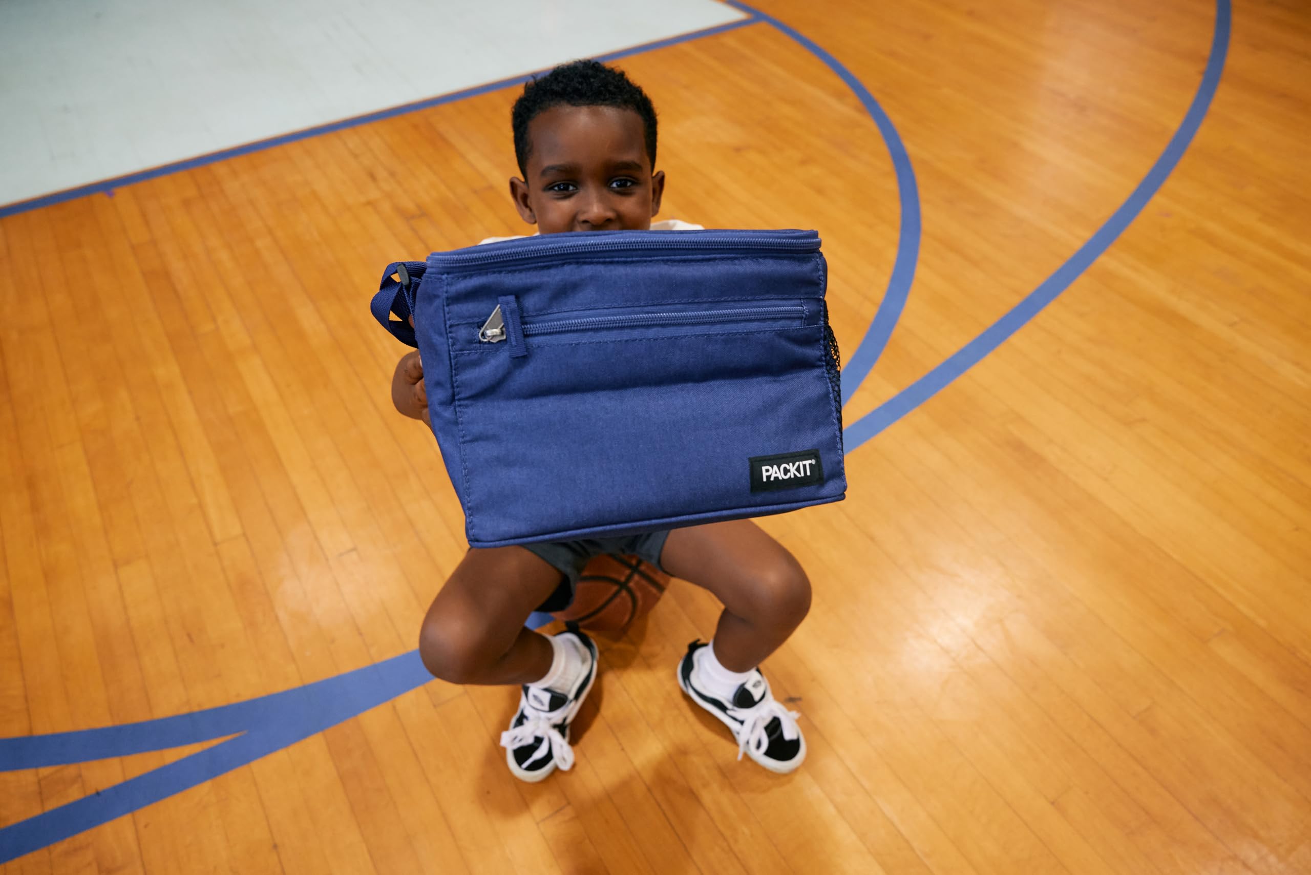PackIt cooler on a lunch table with drinks — convenient daily use