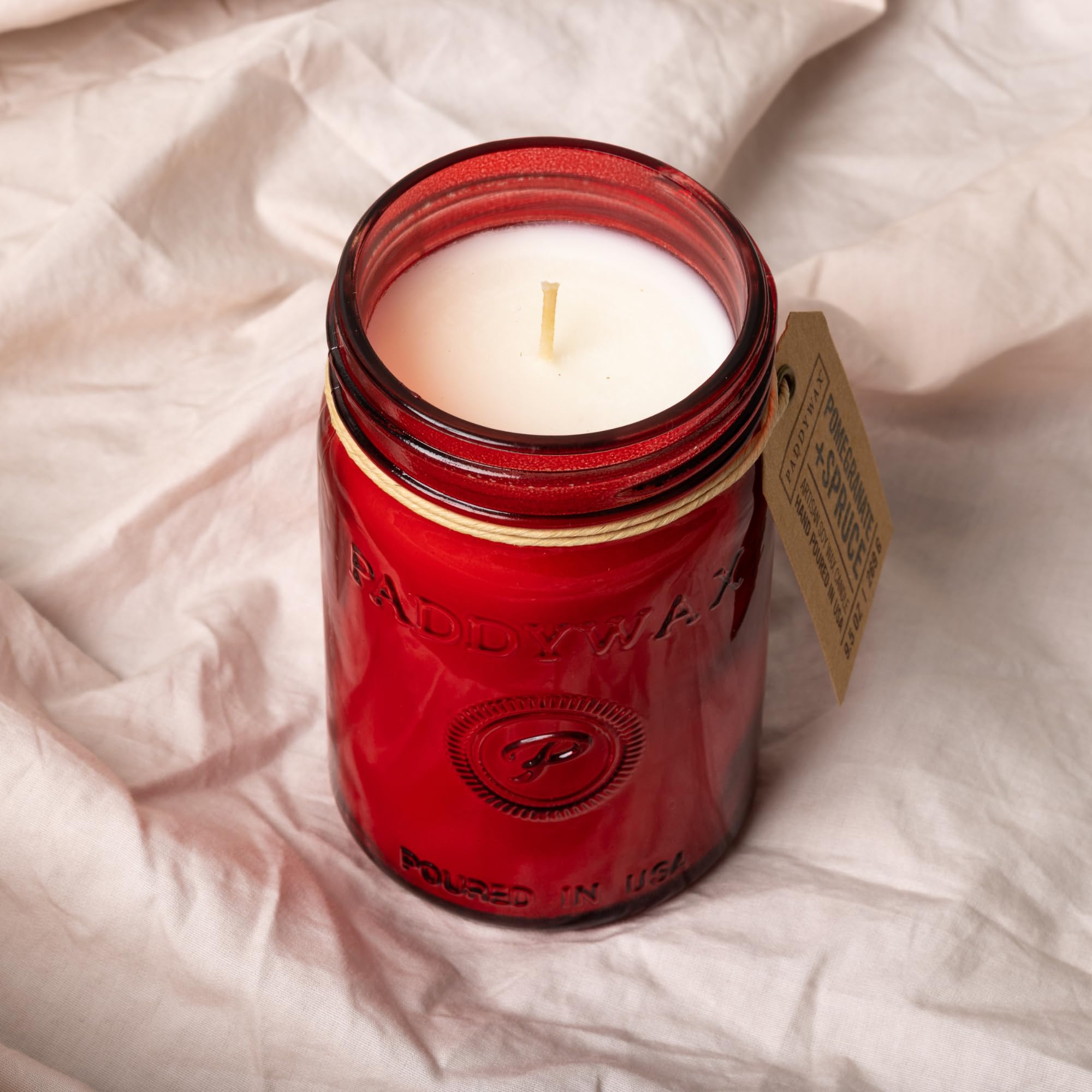 Paddywax Relish close-up of melted soy wax pool and flame, highlighting clean burn