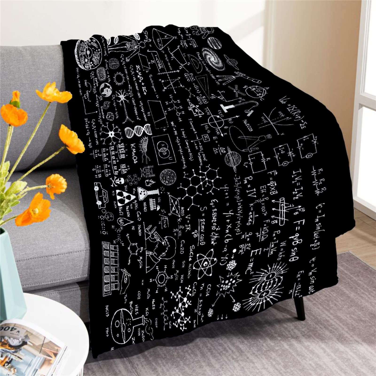 Padumuttara front view of blanket on couch showing full chalkboard print and cozy appeal