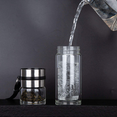 PARACITY bottle held in hand illustrating compact 13 oz size and portability