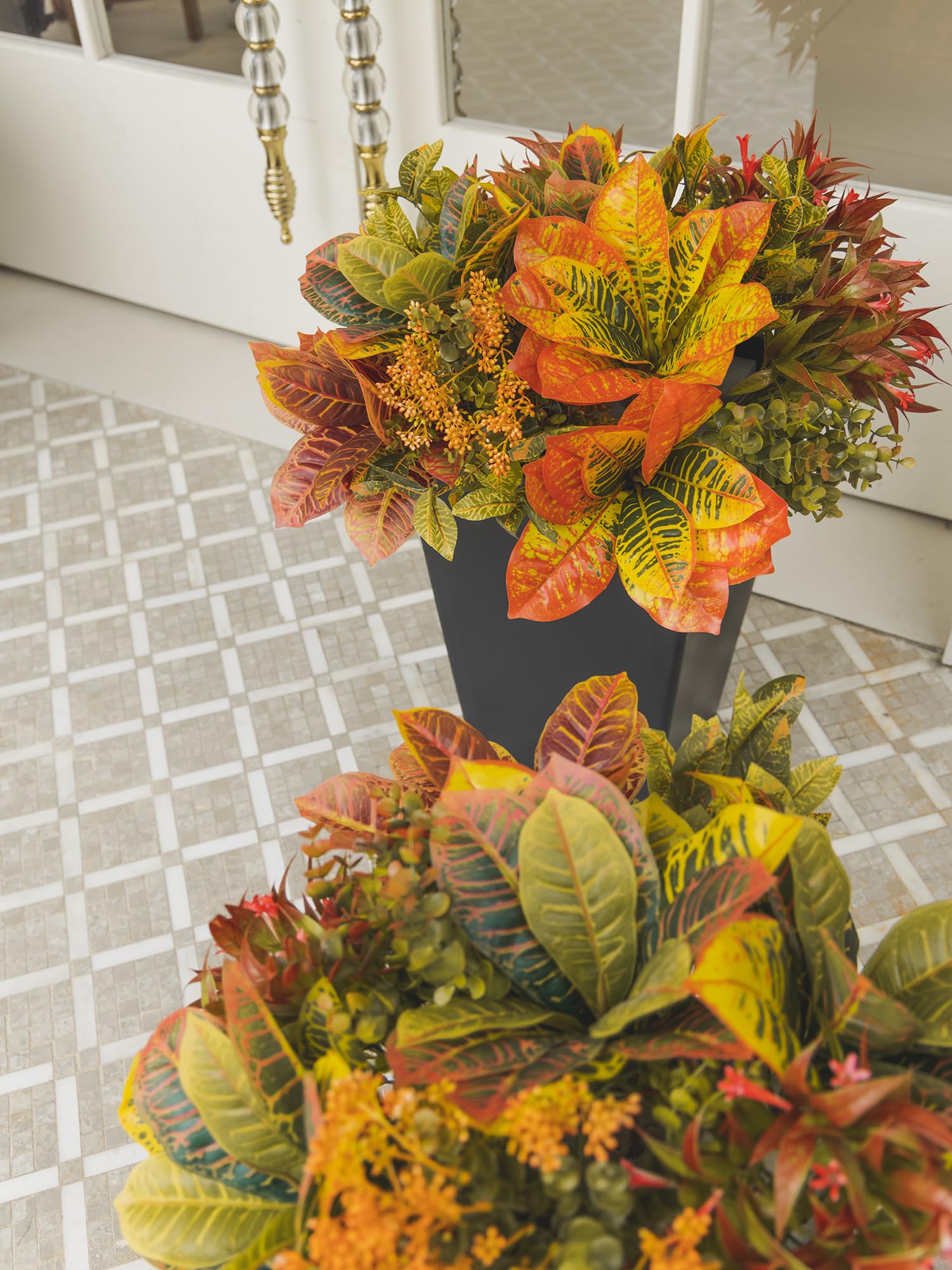 PARTY JOY mixed with live plants on a balcony creating layered, low-care greenery