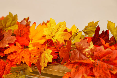 PARTY JOY garlands draped on a mantel creating warm fall ambiance and layered styling