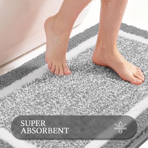 Long 18x48 Pauwer mat placed by shower, protects floor and cushions feet