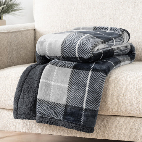 PAVILIA blanket styled on a sofa creating a cozy living room accent