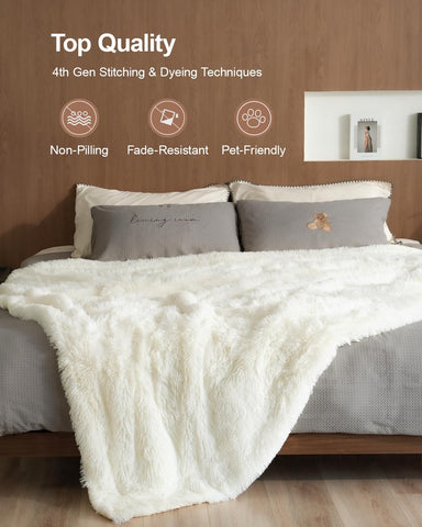 Pawque cream throw folded on bed showing neat decorative layering