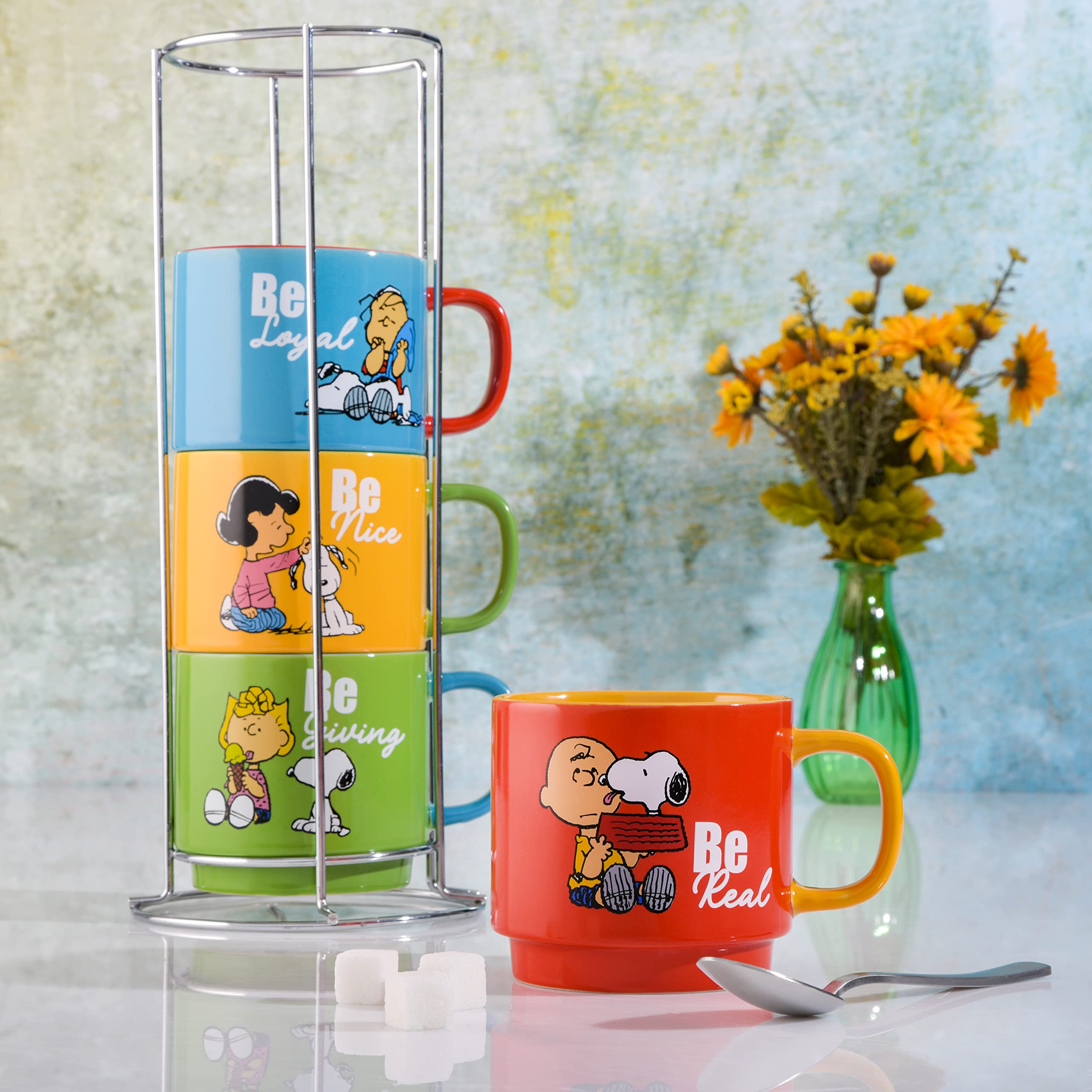Peanuts mugs in hand to show 15oz scale and capacity benefit