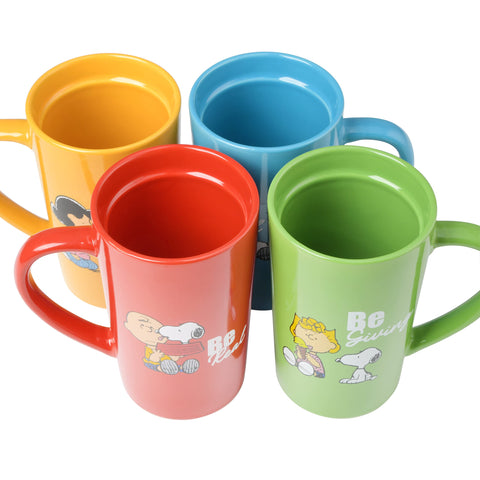 Peanuts Snoopy cup in hand to show 18oz scale and everyday convenience