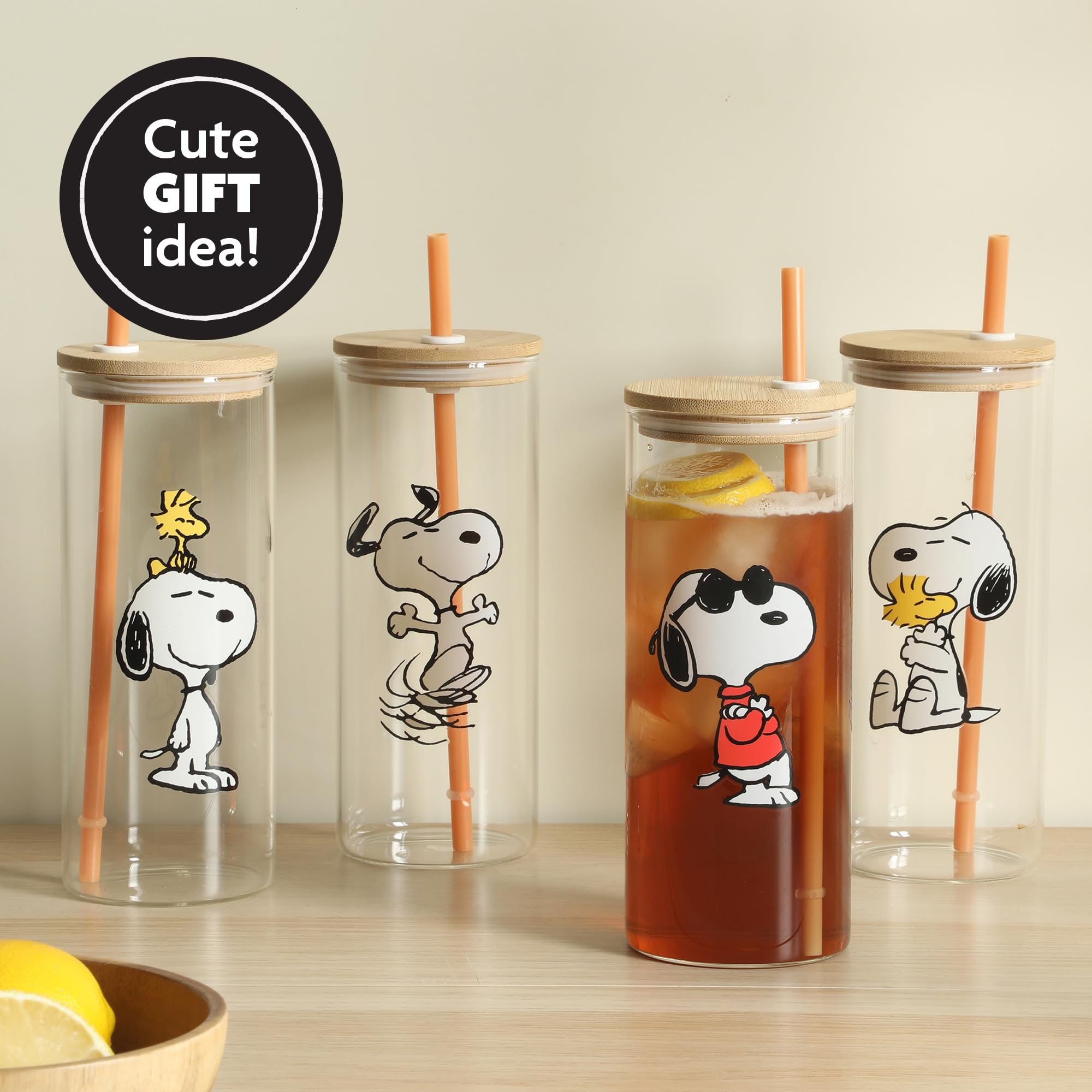 Peanuts snoopy size scale next to hand showing roomy 23 oz capacity benefit