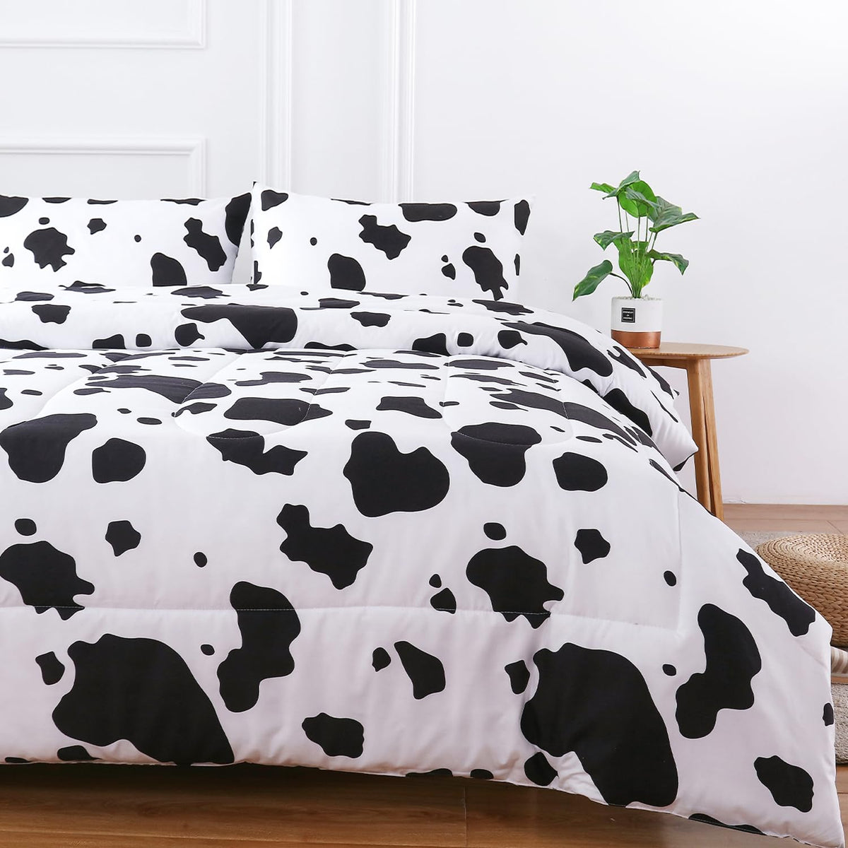 PERFEMET front view of queen comforter showing modern cow print and bold contrast