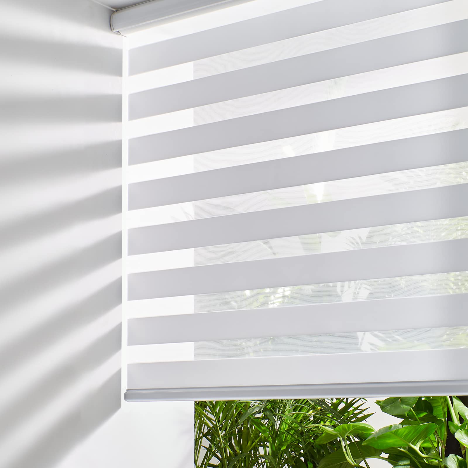 Persilux front view of white zebra blinds showing clean appearance and benefit light control
