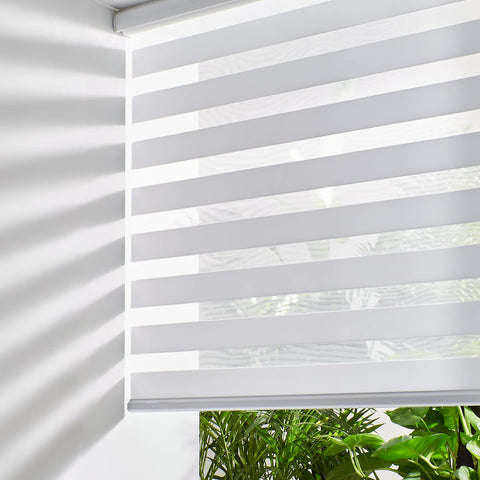 Persilux front view of white zebra blinds showing clean appearance and benefit light control