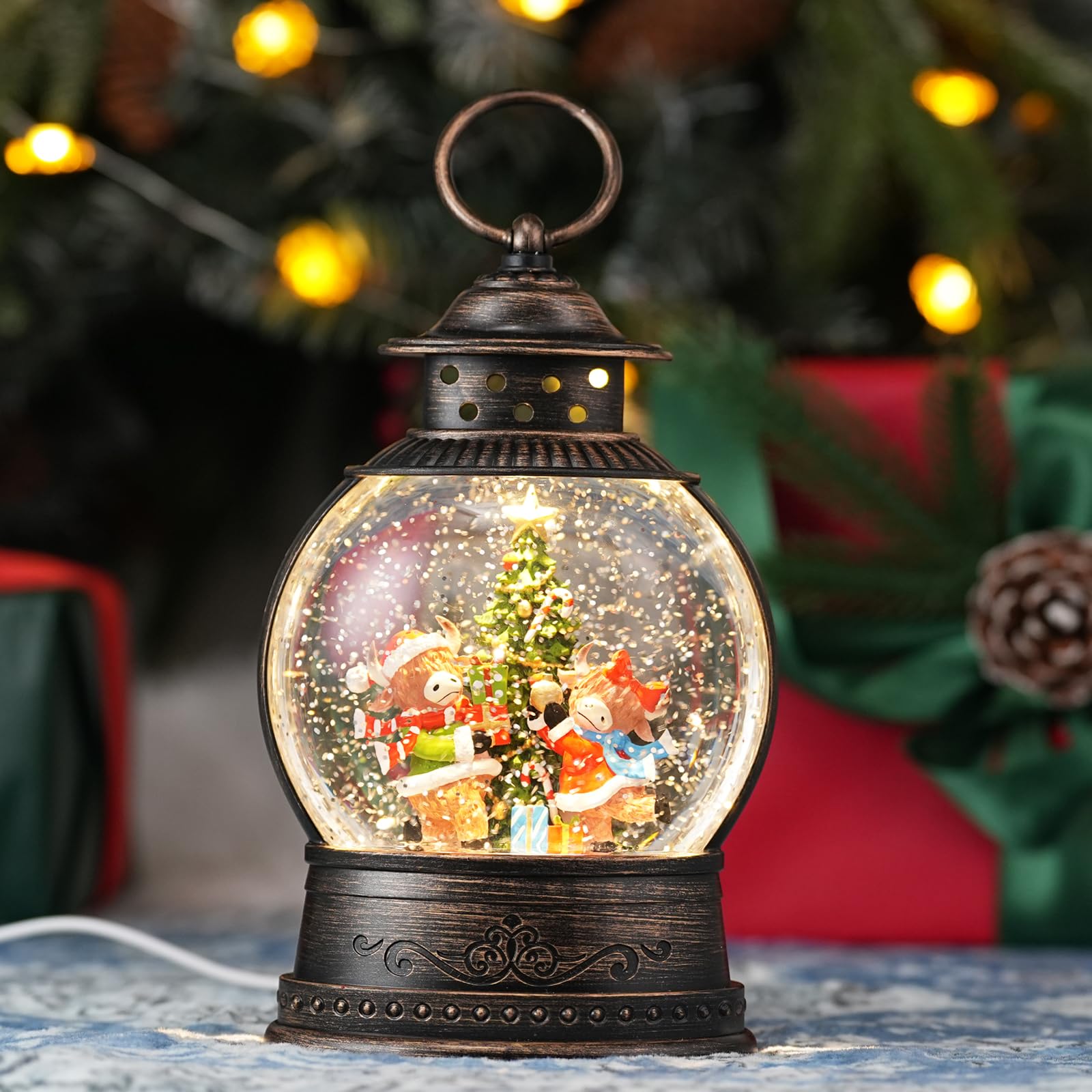 PestiLite front view of lantern showing Highland cow scene and warm glow