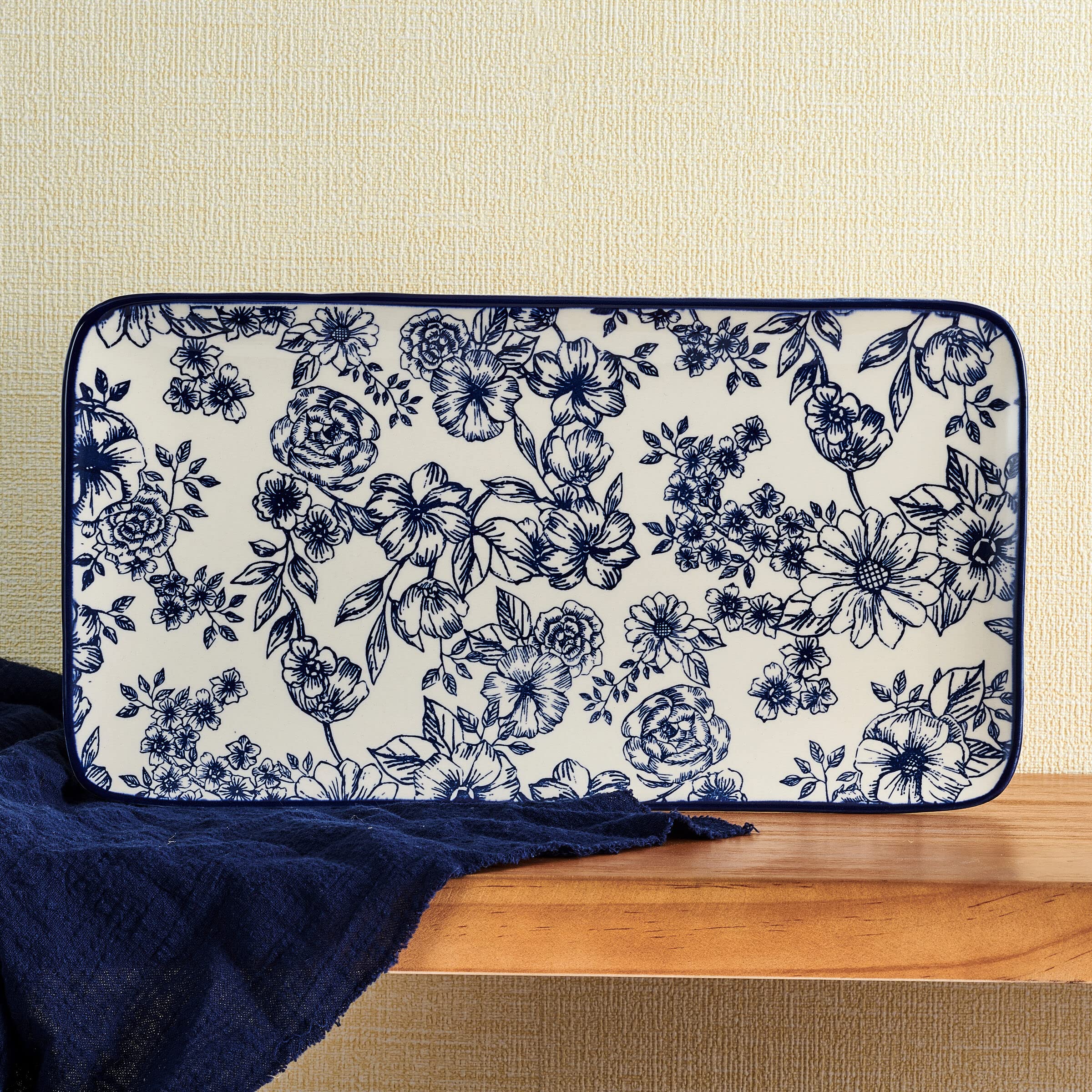 Pfaltzgraff platter next to utensils showing scale and generous 14.75-inch capacity