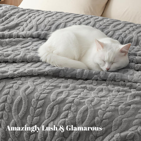 PHF blanket folded on queen bed adding softness and refined décor