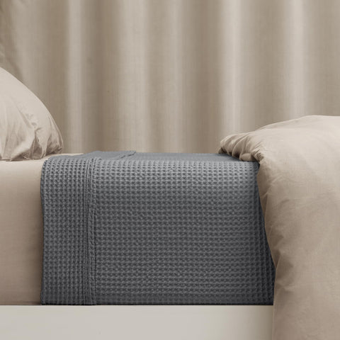 PHF blanket in bedroom lifestyle scene creating a boutique hotel look