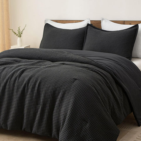 PHF comforter front view in black showing luxurious waffle finish and elegant bedding appeal