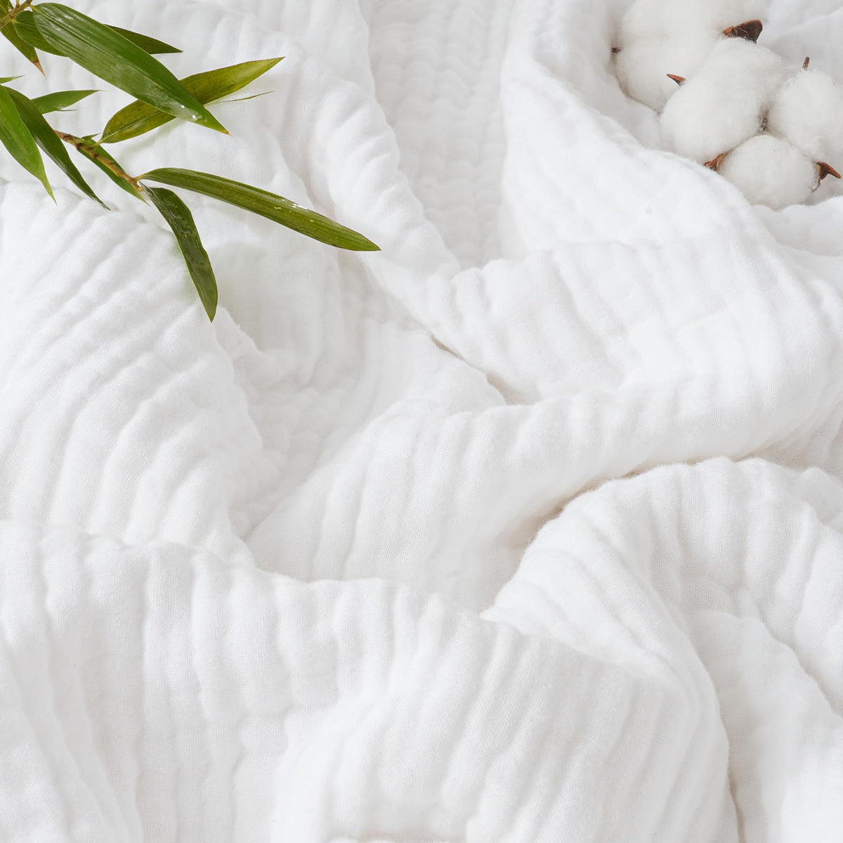 PHF front folded white throw showing lightweight breathable layers and cooling benefit