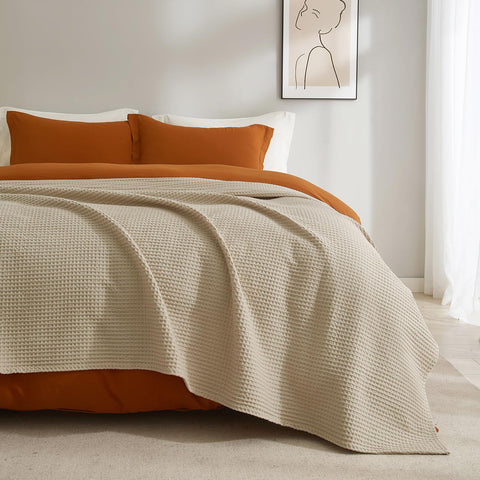 PHF lifestyle bedroom setting with blanket creating calm, hotel-inspired look
