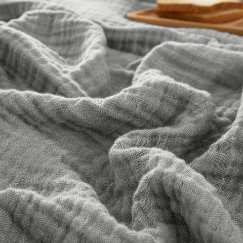 PHF blanket front view showing grey minimalist packaging and soft appeal