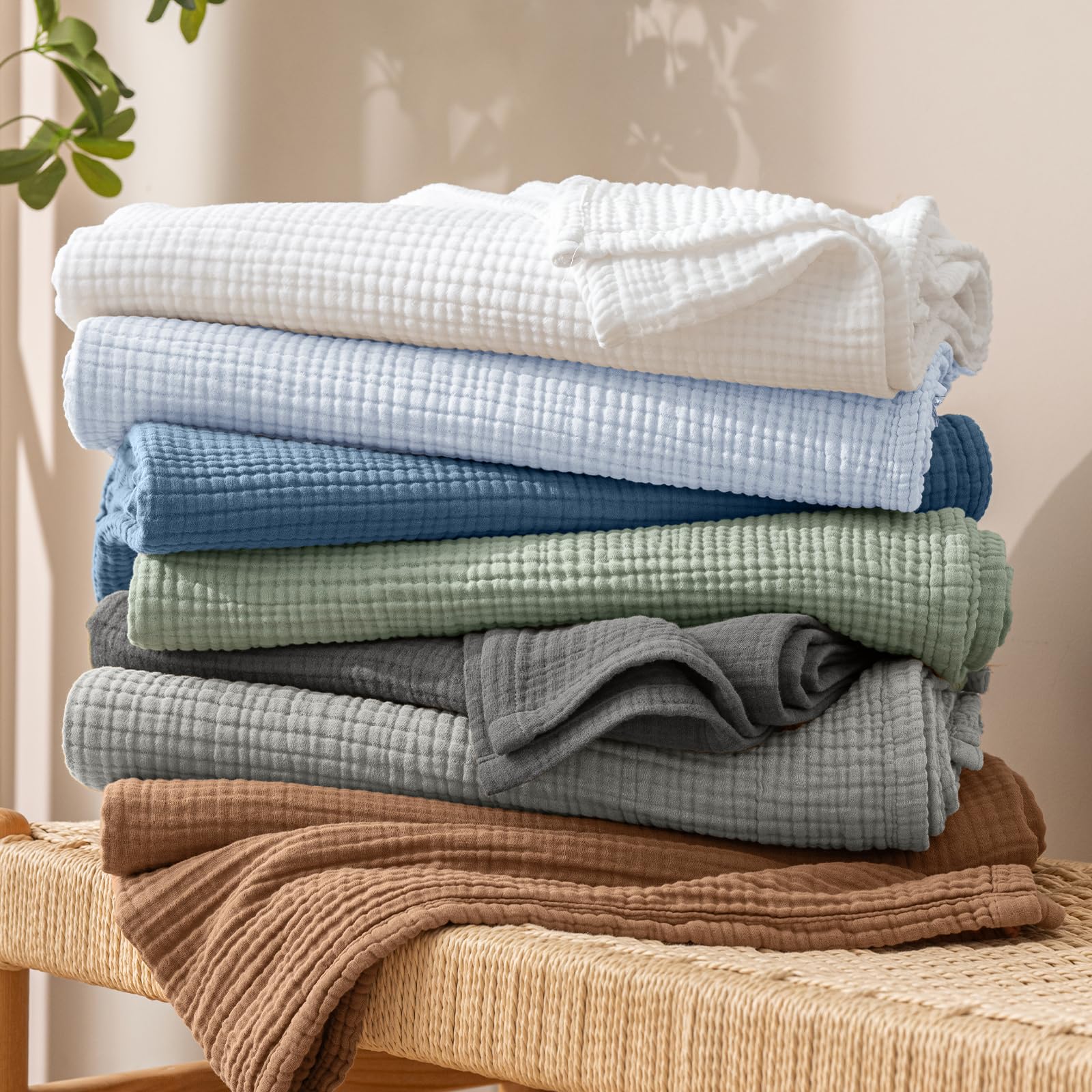 PHF muslin blanket in washer showing easy machine wash care and softness retention