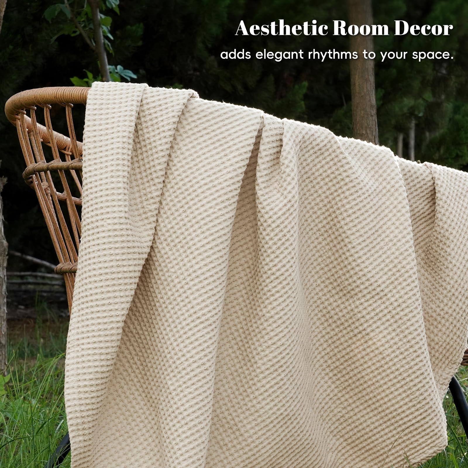 PHF blanket next to hand illustrating lightweight scale and feel