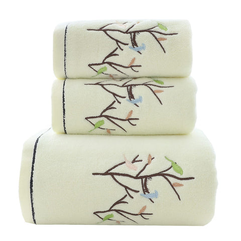 Pidada front view of light-yellow towel set showing decorative birds and trees, enhances bathroom style