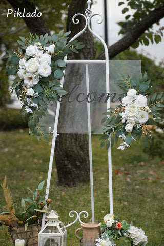 Piklado swag attached to wooden welcome sign showing ease of installation and polished finish