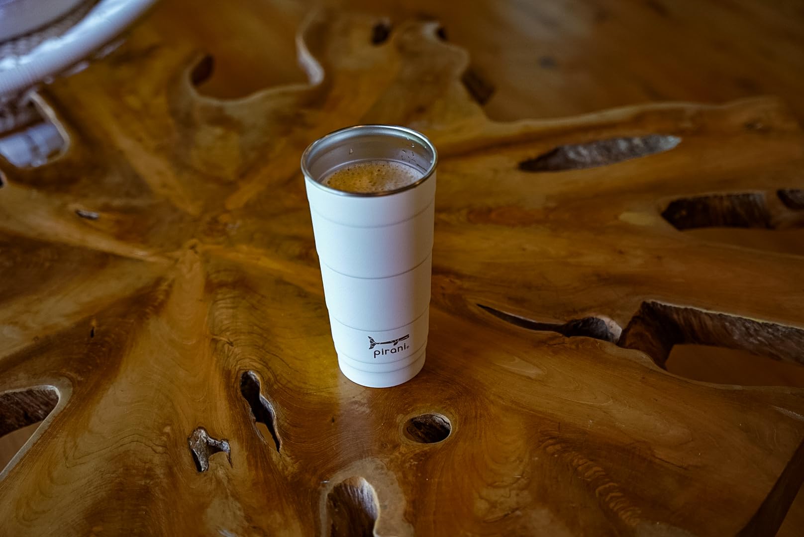 Pirani tumbler held in hand demonstrating slim profile and comfortable grip