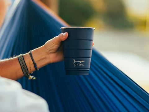 Pirani tumbler seated in car cup holder for spill‑resistant travel