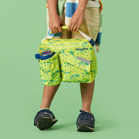 PlanetBox Banana Dino open interior with straps visible to secure utensils and containers for organization