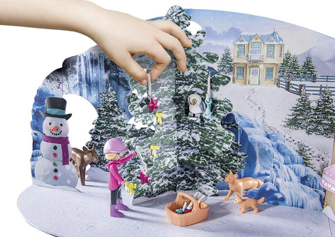 Playmobil forest animals and Lucy the dog staged in a winter lifestyle play scene