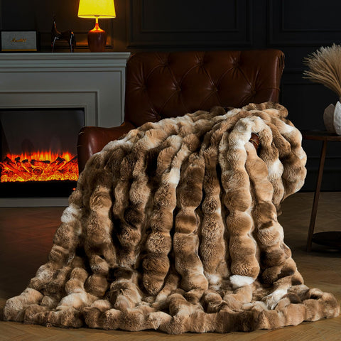 PLUUSHUU front packaging showing tie-dye brown blanket and luxury appeal