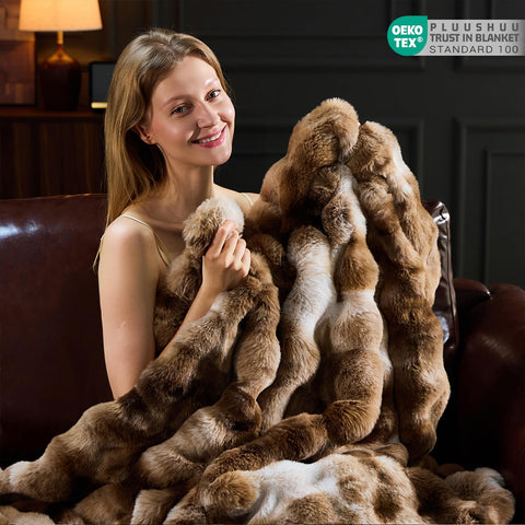 PLUUSHUU on sofa with cushions demonstrating cozy size and drape