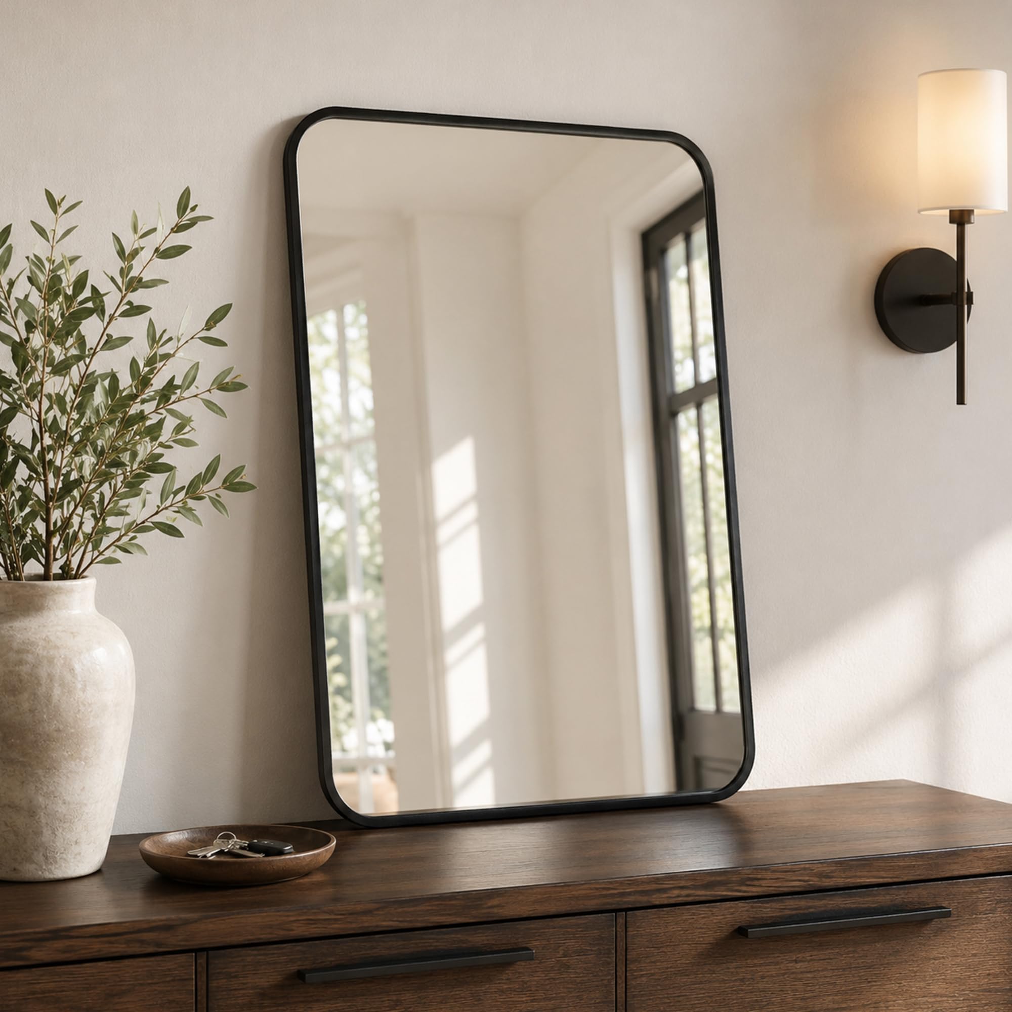 Pocetry pair installed in two bathrooms illustrating cohesive whole-home styling