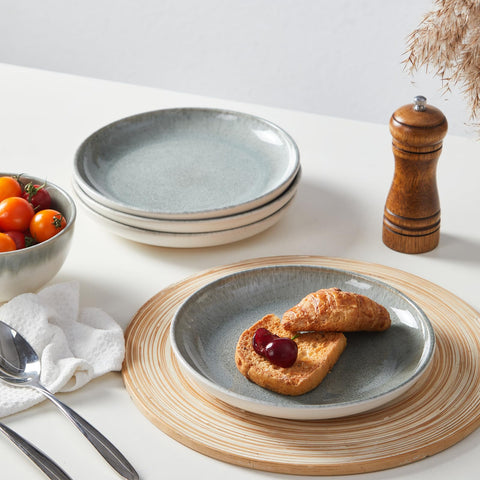 Pokini hand holding plate for size comparison showing practical everyday scale