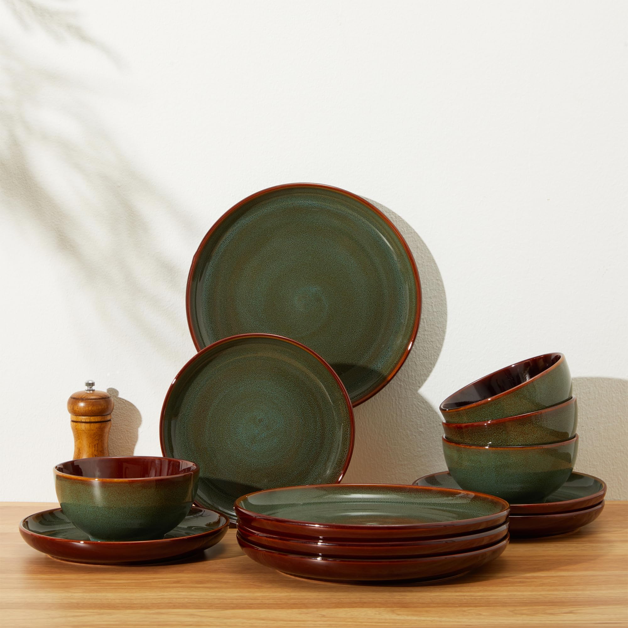 Pokini plate held in hand for size comparison showing practical scale