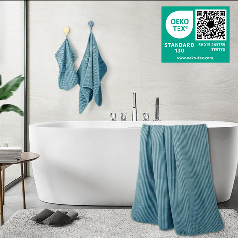POLYTE bath towel beside ruler showing 30x60 inch size for coverage