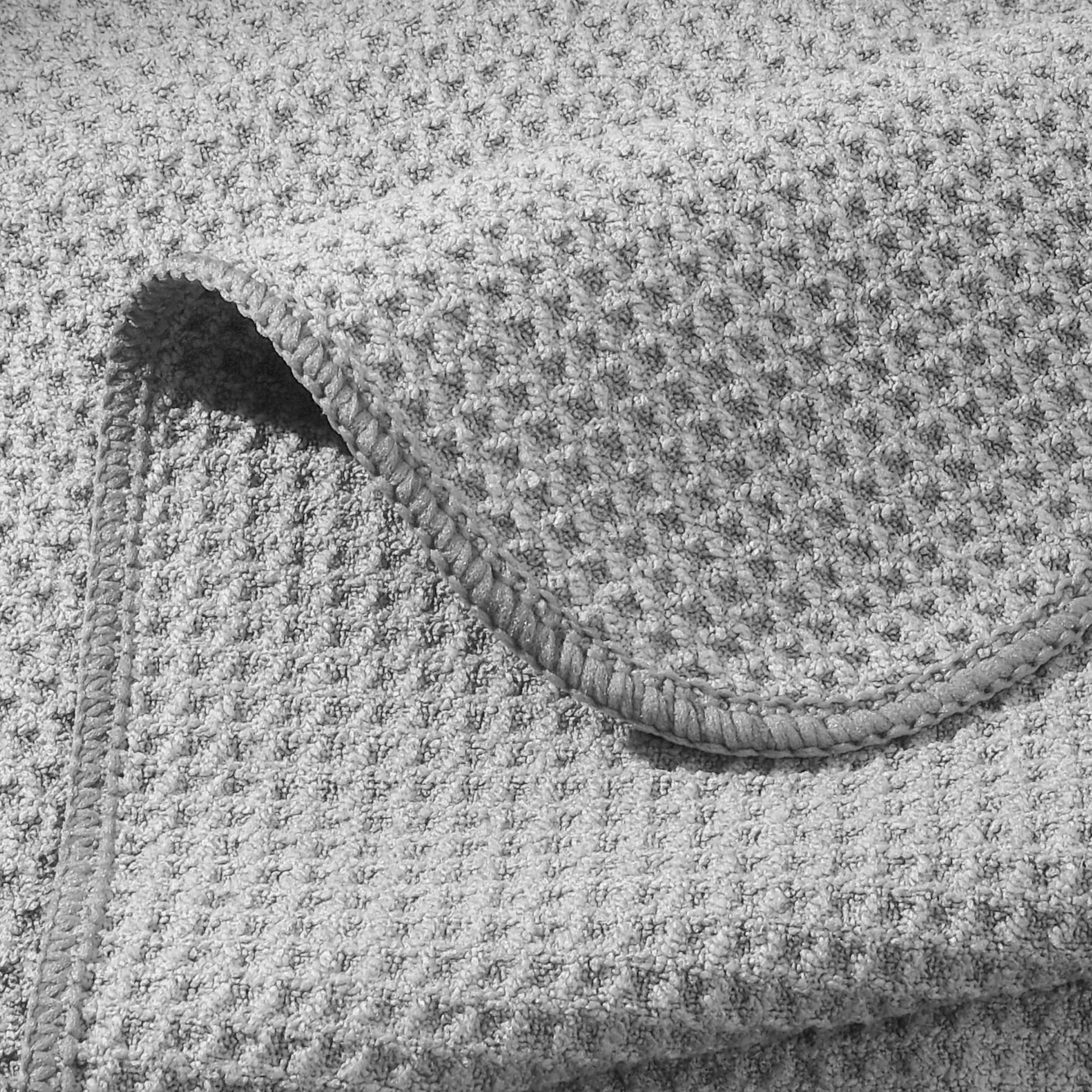POLYTE stacked towels demonstrating 16x28 inch size and generous coverage