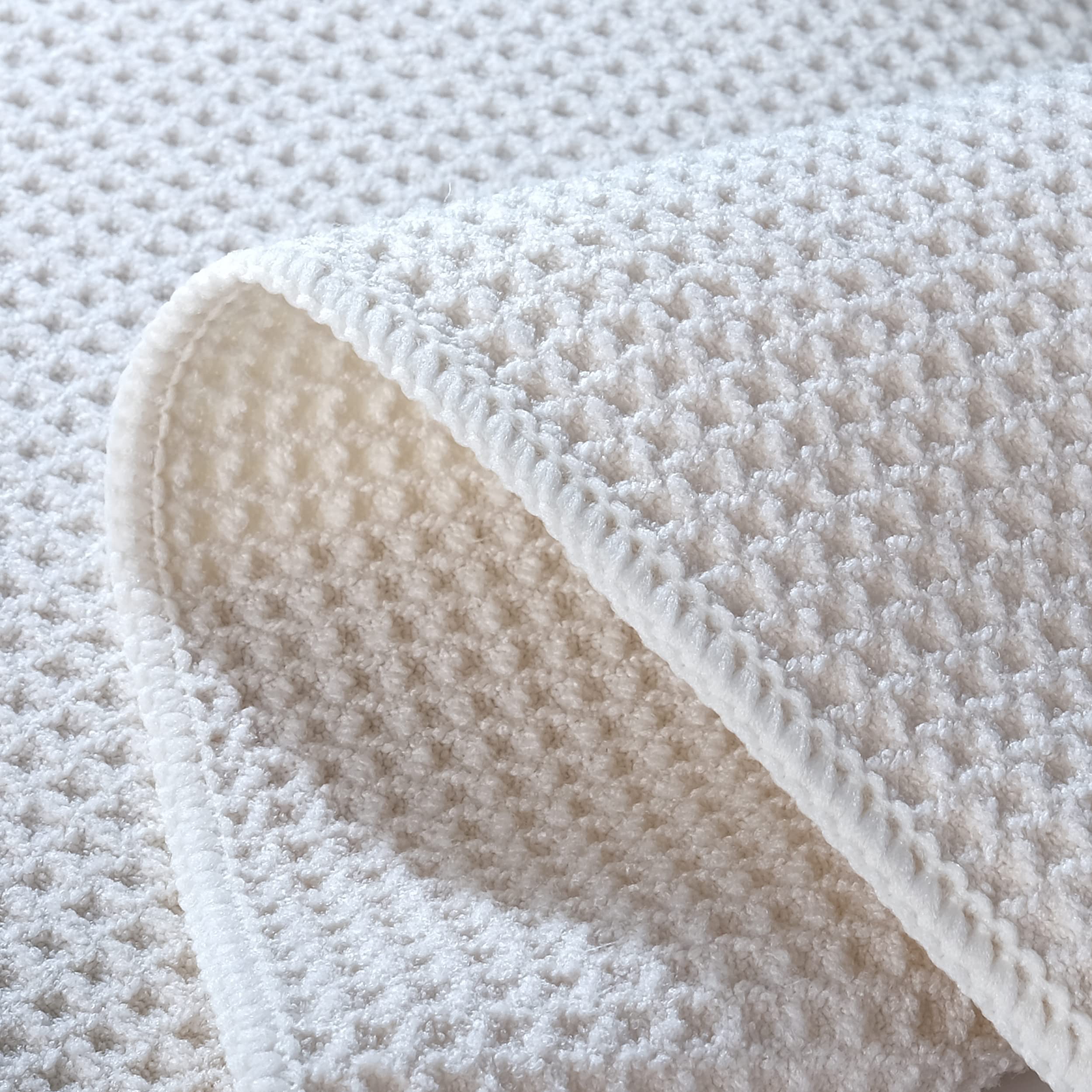 POLYTE towel in hand drying glassware for streak-free, lint-free shine