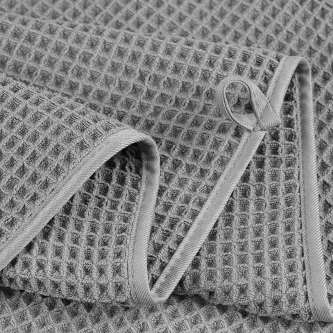 POLYTE stack of four towels showing set quantity and organized storage