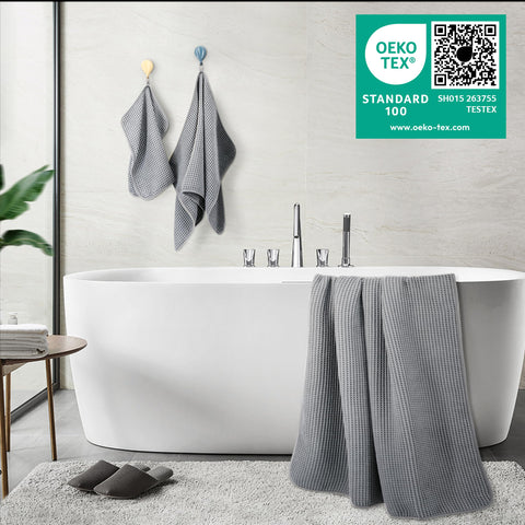 POLYTE towels styled in a bathroom conveying spa comfort and space saving