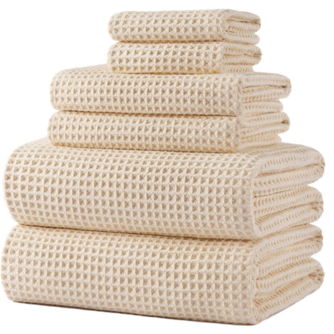 POLYTE folded waffle towel set showing neat stack and soft feel benefit