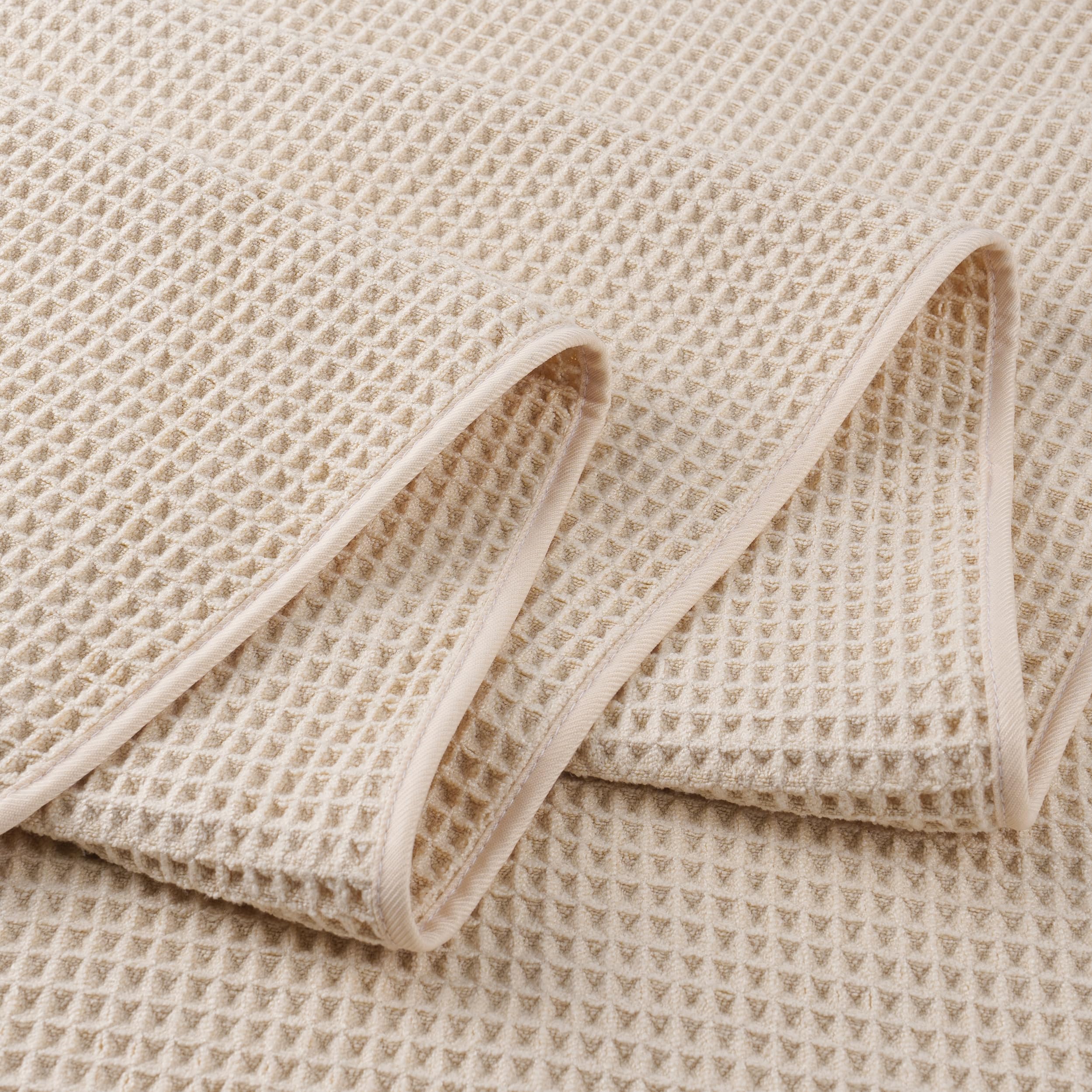 POLYTE towel next to standard towel showing larger size advantage