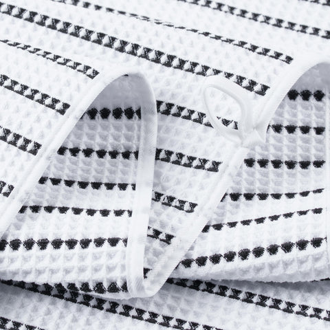 POLYTE towel on person to show 30x60 inch full-body coverage benefit