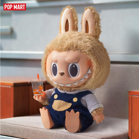 POP MART Big Labubu next to books to show scale and how it anchors shelves